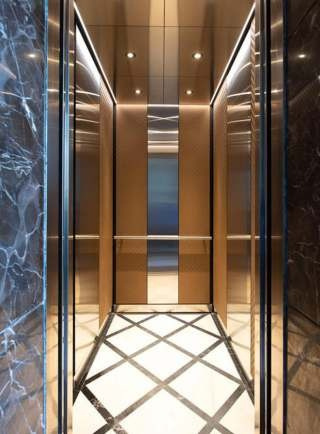 Luxury elevator cabin with marble side panels