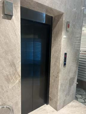 Automatic elevator door installation